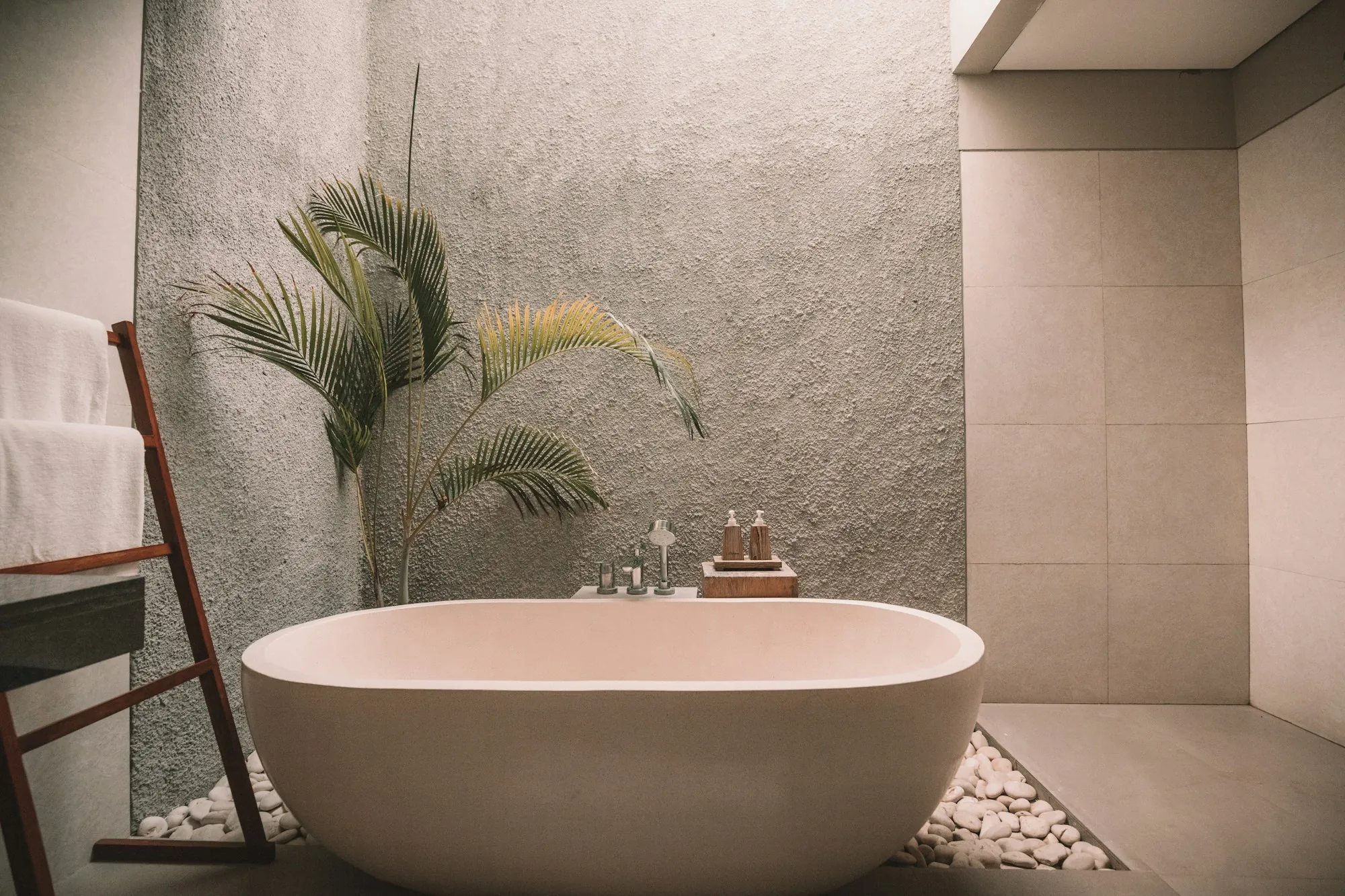 Remodeled bathroom with a glass-enclosed tile shower and a double vanity