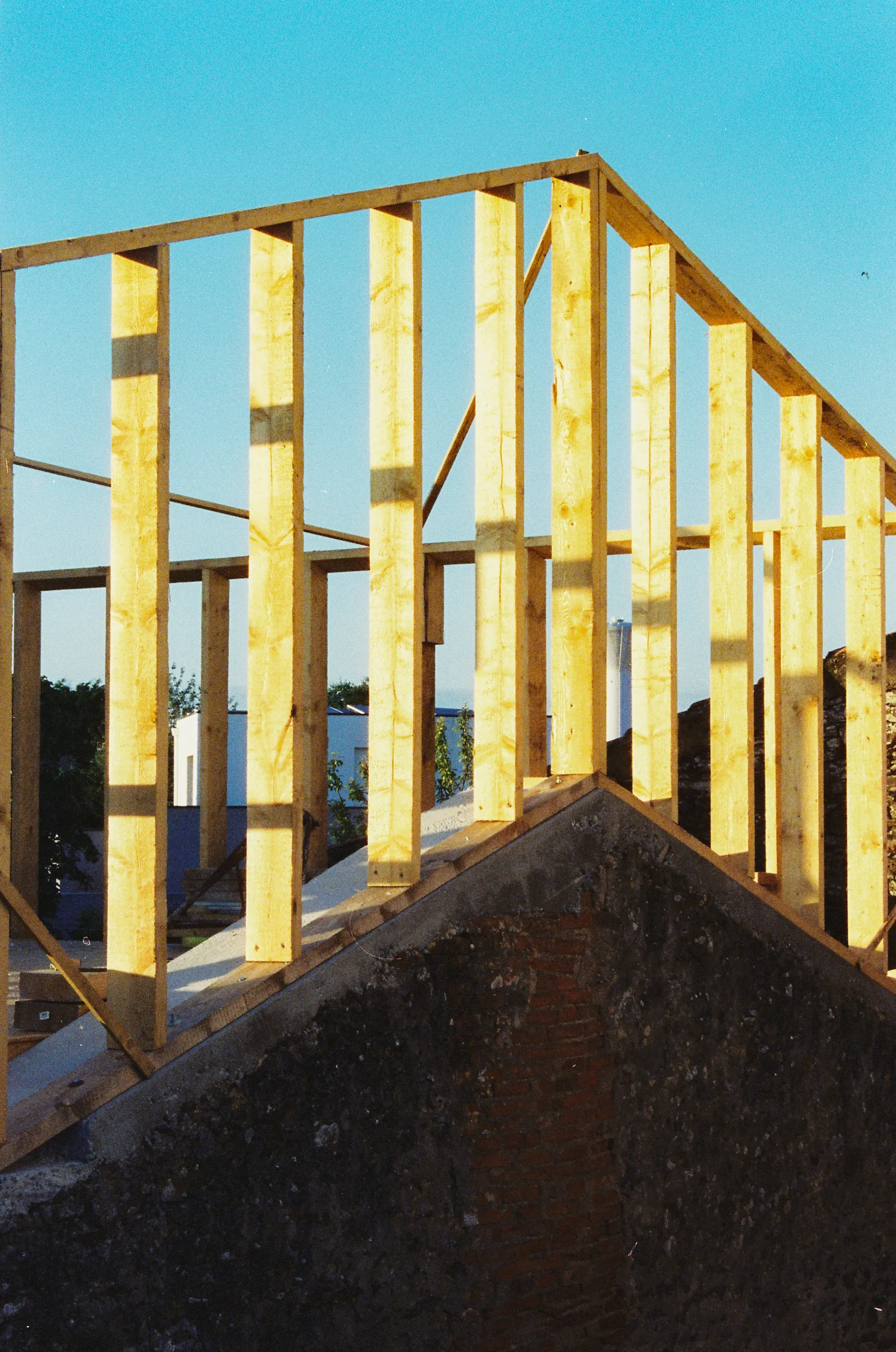 Primary suite addition with large windows and vaulted ceiling